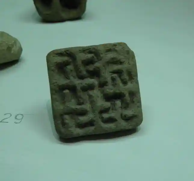 Bunch of swastikas and crosses designed on a stone